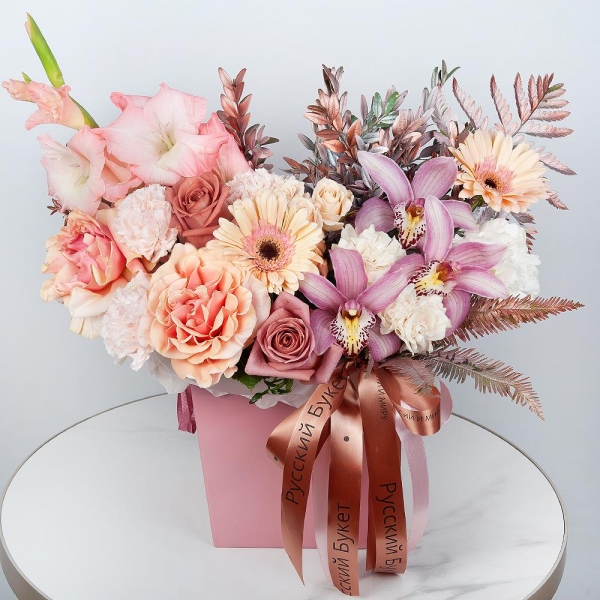 Rose Pink 50 cm Ecuador (Chelo, Hermosa, Novia, Titanik, Engagement, Pink Mondiale) - 5, Carnation white, cream - 8, Pink Gladiolus - 1, Pink Cymbidium Orchid Bud - 3, Gerbera pink - 3, Spray rose: white, cream, light pink 50 cm - 1, Flask for orchids, Fern (1 pc.), Pistachio, Composition Box, Oasis, Ribbon