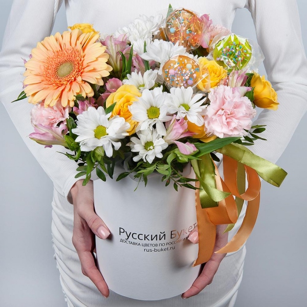 Gerbera yellow - 1, Pink carnation - 5, Alstromeria white, soft pink - 4, Bacardi White Spray Chrysanthemum - 2, Spray rose: yellow, orange 50 cm - 2, Round flower box small , Ribbon, Oasis, Pistachio, Topper (for flowers)