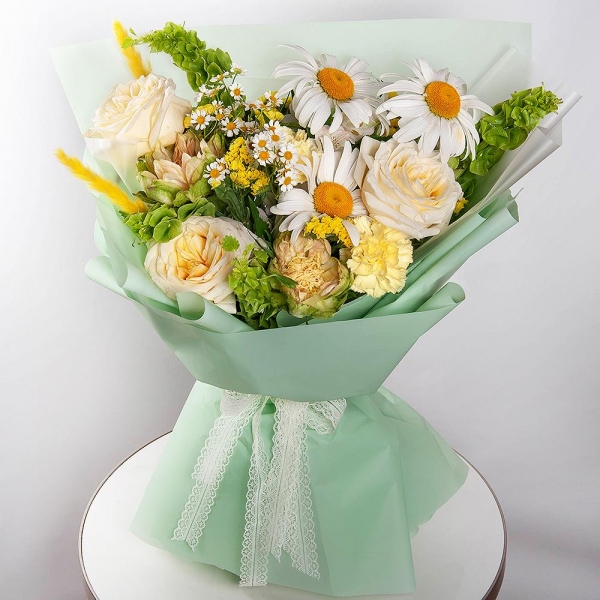 Gerbera white - 7, Chamomile - 1, White rose 50 cm Ecuador - 3, Rose Veggie 50 cm - 2, Yellow carnation - 6, Baltica White Spray Chrysanthemum - 1, Yellow Statice, Dried flowers in assortment, Wrapping Paper, Moluccella