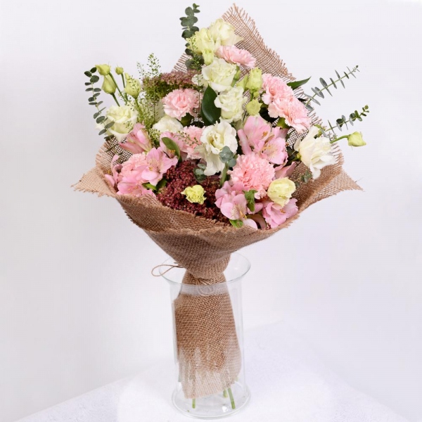 Pink carnation - 11, Alstromeria white, soft pink - 4, lisianthus - 6, Sedum, Ruscus, Green bell (1 pc.), Eucalyptus baby blue (1 pc.), Sackcloth, 1m, Ribbon