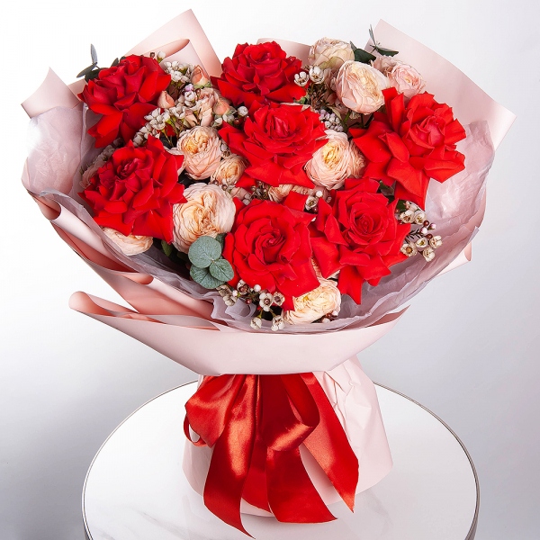 Red rose Nina 50 cm - 9, Spray rose: white, cream, light pink 50 cm - 7, Waxflower (1 pc.), Wrapping Paper, Eucalyptus