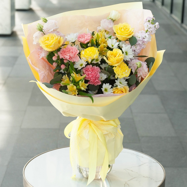 Pink carnation - 5, Yellow carnation - 2, Alstromeria Yellow, Orange - 5, Rose Yellow 50 cm Ecuador (Mohana, Latina, Brighton) - 7, Pink Lisianthus (Eustoma) - 3, Bacardi White Spray Chrysanthemum - 3, Pink Matthiola - 1, Hypericum, Wrapping Paper, Eucalyptus baby blue (1 pc.)