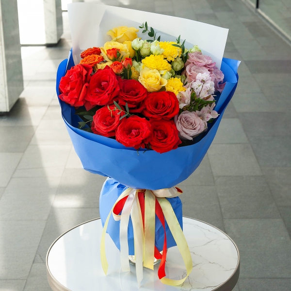 Red rose Nina 50 cm - 9, Spray rose: yellow, orange 50 cm - 4, Bright pink spray rose mix, 50 cm - 5, Rose Pink 50 cm Ecuador (Chelo, Hermosa, Novia, Titanik, Engagement, Pink Mondiale) - 6, Yellow carnation - 7, Pink Matthiola - 1, Alstromeria lilac, purple - 3, Eucalyptus parvifolia (1 pc.), Wrapping Paper