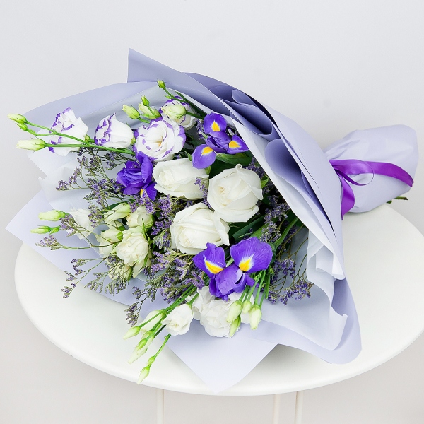 Irises - 3, lisianthus - 1, White rose 50 cm - 3, Spray rose: white, cream, light pink 50 cm - 1, Purple Lisianthus (Eustoma) - 1, Limonium (1 pc.), Wrapping Paper