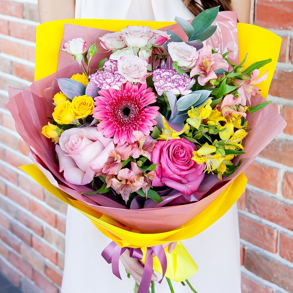 Gerbera pink - 2, Alstromeria white, soft pink - 2, Pink carnation - 3, Spray rose: yellow, orange 50 cm - 2, Pink rose 50 cm - 3, Alstromeria Yellow, Orange - 1, Spray rose: white, cream, light pink 50 cm - 1, Ruscus, Wrapping Paper