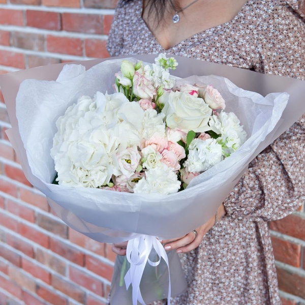  White Hydrangea - 1, Carnation white, cream - 5, Pink Lisianthus (Eustoma) - 3, White rose 50 cm - 3, White Matthiola - 3, Spray rose: white, cream, light pink 50 cm - 3, Wrapping Paper