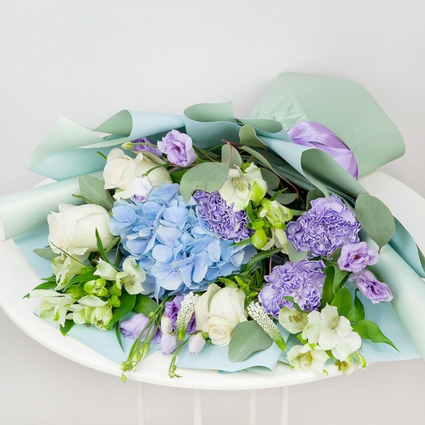 Blue/purple hydrangea - 2, Lilac carnation - 5, Alstromeria white, soft pink - 4, Purple Lisianthus (Eustoma) - 4, White rose 50 cm - 5, Veronica spray, Eucalyptus populus (1 pc.), Wrapping Paper