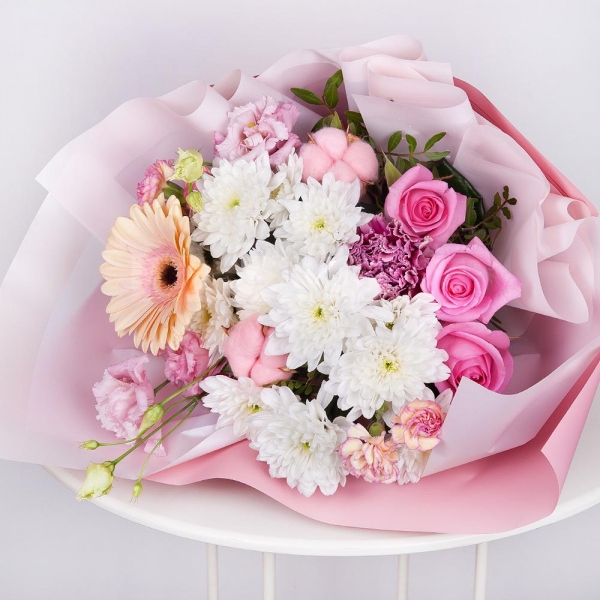 Baltica White Spray Chrysanthemum - 3, Pink spray carnation - 3, Pink Lisianthus (Eustoma) - 1, Lilac carnation - 2, Cream gerbera - 1, Pink rose 50 cm - 3, Cotton bud, Wrapping Paper