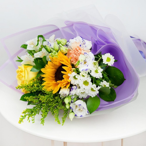 Sunflower - 1, Yellow rose 50 cm - 2, Carnation white, cream - 1, Santini White Spray Chrysanthemum - 2, Alstromeria white, soft pink - 1, lisianthus - 2, Solidago (1 pc.), Ruscus, Ribbon, Wrapping Paper