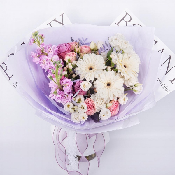 Gerbera white - 3, Pink rose 50 cm - 7, Peony sprayrose - 3, Carnation white, cream - 5, Matthiola Lilac - 2, lisianthus - 4, Hypericum, Pistachio, Wrapping Paper