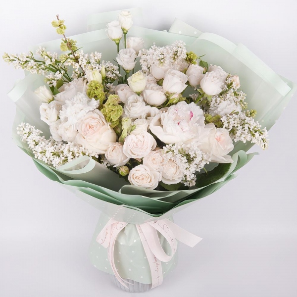 Peony white - 3, Peony style roses - 5, Peony sprayrose - 8, lisianthus - 5, Carnation white, cream - 5, White Lilac - 5, Wrapping Paper, Ribbon