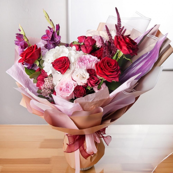  White Hydrangea - 1, Red rose 50 cm - 7, Peony rose pink 'OHara' - 2, Pink Gladiolus - 3, Spray rose: red 50 cm - 3, Pink Lisianthus (Eustoma) - 3, Eucalyptus Cinerea, Celosia, Ozotamnus, Aspidistra (1 pc.), Wrapping Paper