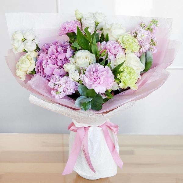Pink Hydrangea - 1, Alstromeria white, soft pink - 4, Pink Matthiola - 4, White rose 50 cm - 7, lisianthus - 3, Green carnation - 4, Pink carnation - 4, Pistachio, Ruscus, Wrapping Paper