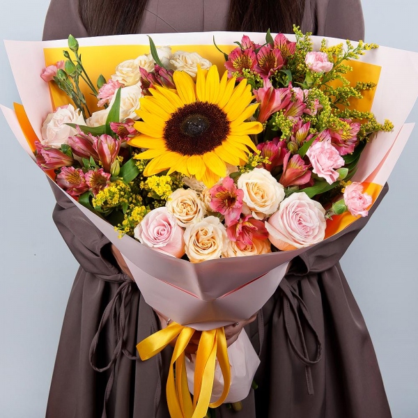 Sunflower - 1, Spray rose: white, cream, light pink 50 cm - 2, Pink rose 50 cm - 4, Pink spray carnation - 4, Alstromeria Red, Bright Pink - 6, Baltica White Spray Chrysanthemum - 1, Solidago (1 pc.), Wrapping Paper