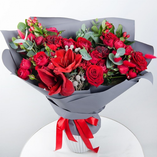 Red amaryllis - 1, Carnation red - 7, Red rose 50 cm - 6, Spray peony rose Misty Bubbles, 50 cm - 5, Dried flowers in assortment, Eucalyptus, Hypericum, Wrapping Paper, Brunia Green Lanuginosa (1 pc.)