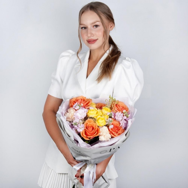 Rose Orange 50 cm Ecuador (High Magic, High Yollow Magic) - 5, Spray rose: yellow, orange 50 cm - 1, Baltica White Spray Chrysanthemum - 1, Carnation white, cream - 6, Matthiola Lilac - 2, Astilbe, Wrapping Paper