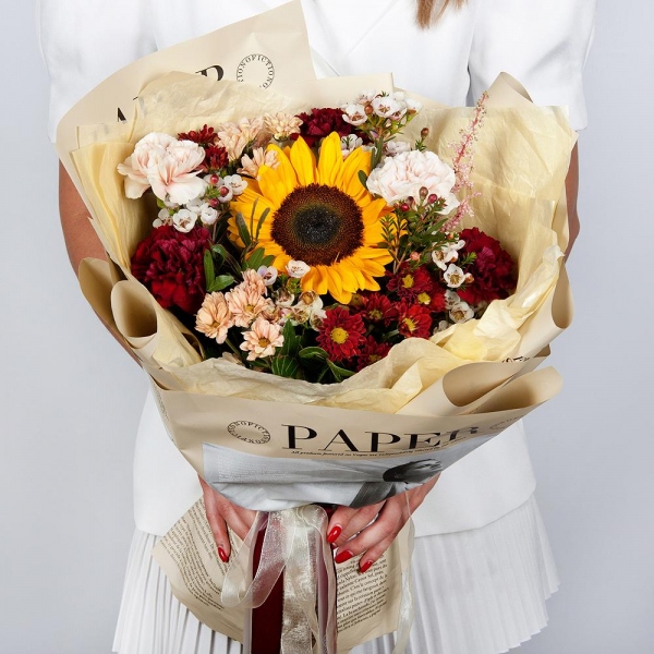 Sunflower - 1, Daisy poms Santini pink, purple - 6, Carnation red - 5, Carnation white, cream - 4, Waxflower (1 pc.), Astilbe, Pistachio, Wrapping Paper